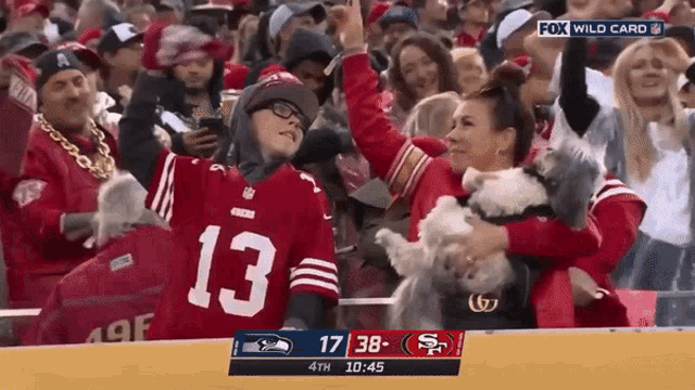 a person wearing a red jersey with the number 13