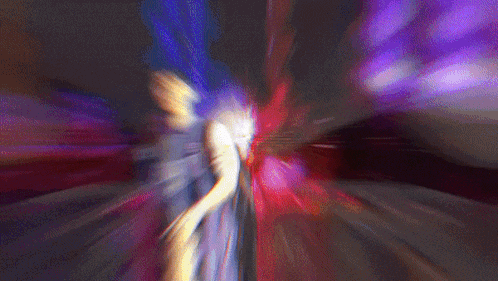 a blurry picture of a person in a purple and red light