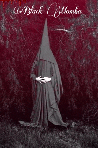 a black and white photo of a person with a cone on their head and the words black momba