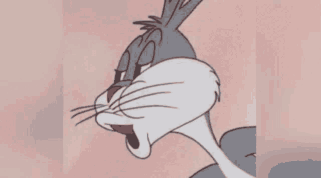 a close up of bugs bunny 's face with the word tourtiere below it