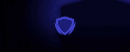 a blue shield is glowing in the dark against a black background .