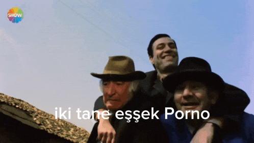 three men are standing next to each other with the words iki tane essek porno in the corner