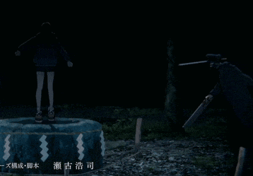 a man holding a sword stands next to a woman standing on a rock in the dark