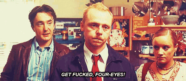 a man says get fucked four eyes while standing next to two other people