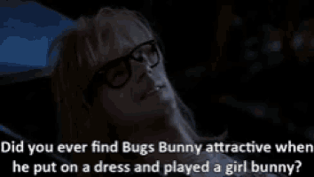 a man wearing glasses is laying on a bed with the words did you ever find bugs bunny attractive when