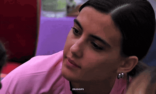 a close up of a woman 's face with the words zeudigifs on the bottom
