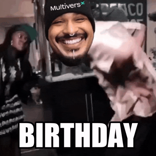 a man wearing a hat that says multivers on it is smiling