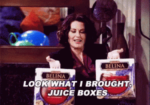 a woman is holding two boxes of belina juice and saying look what i brought juice boxes