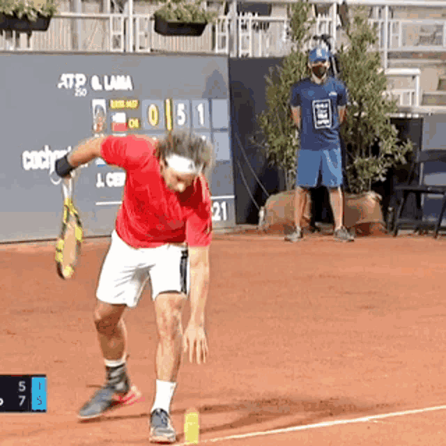 a man playing tennis on a court with a scoreboard that says atp & lama on it