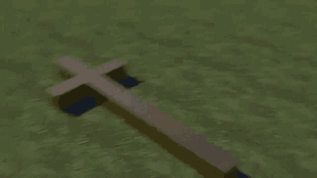 a blurry picture of a field with a building in the background