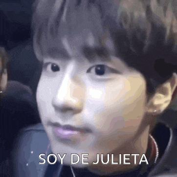 a close up of a person 's face with the words `` soy de julieta '' written on the bottom .
