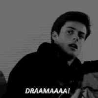 a black and white photo of a young man making a funny face and saying draamaaa !