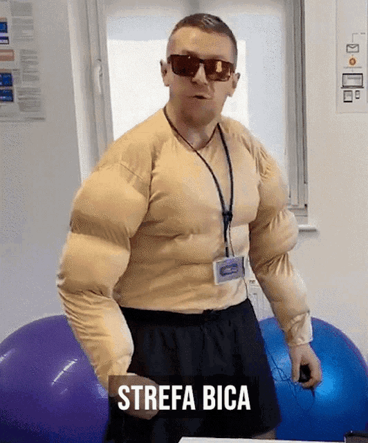 a man in a muscle suit with the word strefa bica on the bottom right