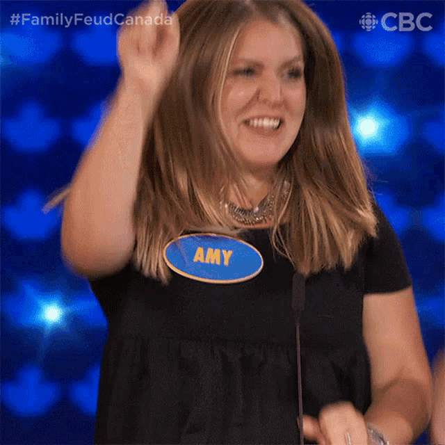 a woman with a name tag that says amy