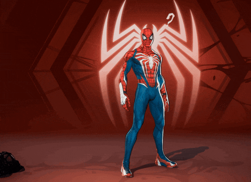 a spider man stands in front of a red background
