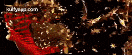 a close up of a red and gold object with the words kulfyapp.com in the corner