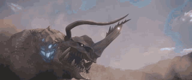a close up of a monster with horns and sharp teeth in the fog .