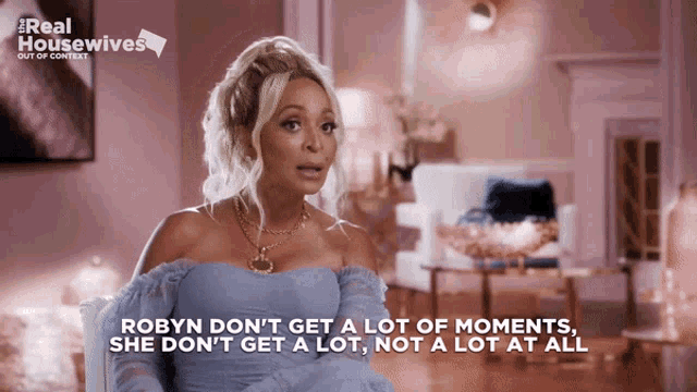 a woman in a blue dress says robyn don t get a lot of moments