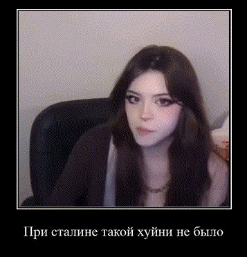 a woman with long hair is sitting in a chair and looking at the camera with a black frame .