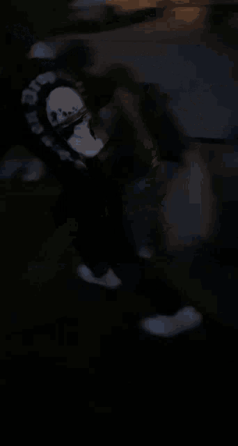 a blurry picture of a person jumping on a trampoline at night