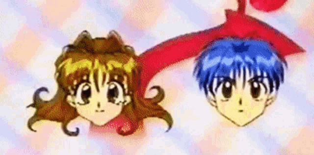 a boy and a girl are standing next to each other and their heads are visible .