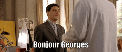 a man in a suit says bonjour georges while talking to another man