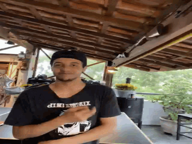 a man wearing a black t-shirt that says ' xtreme hop ' on it