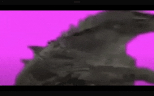 a computer screen shows a purple background with a gray object in the foreground