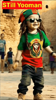 a young boy wearing sunglasses and a rasta hat is standing in front of a sign that says still yooman on it