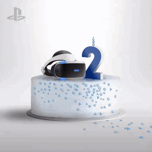 a birthday cake with a virtual reality headset and the number 2