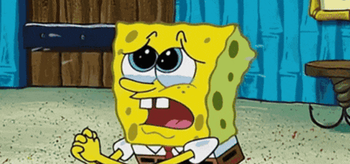 a cartoon character named spongebob is sitting on the floor and crying .