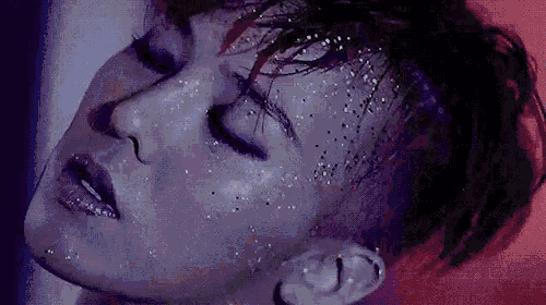 a close up of a person 's face with a lot of glitter on it .