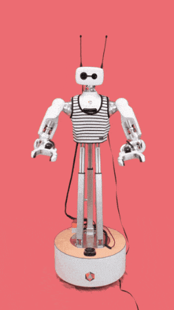 a robot is holding a pink heart on its chest
