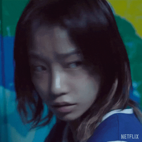 a close up of a woman 's face with netflix written on the bottom right