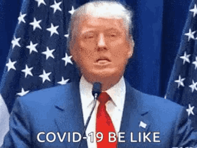 donald trump is giving a speech at a podium in front of an american flag .