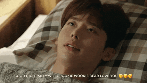 a man is laying in a bed with the words good night silly willy pookie wookie bear love you