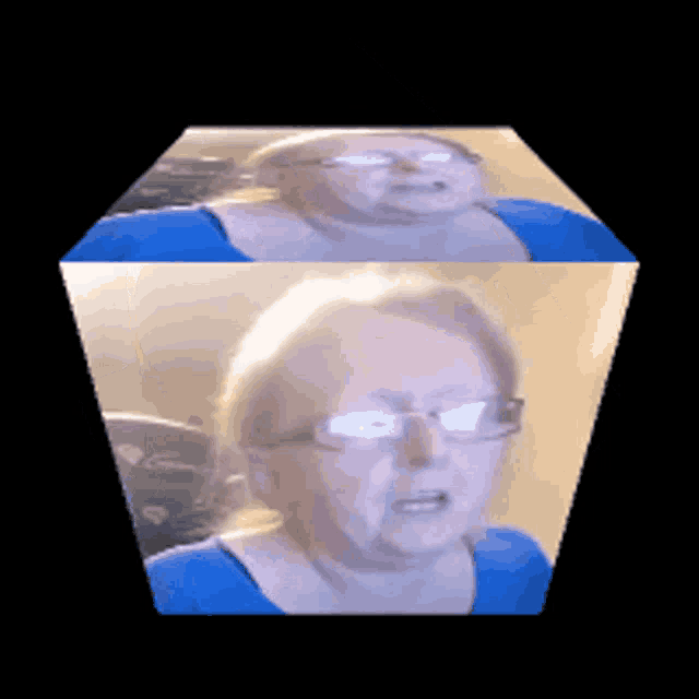 a woman wearing glasses and a blue shirt is in a box