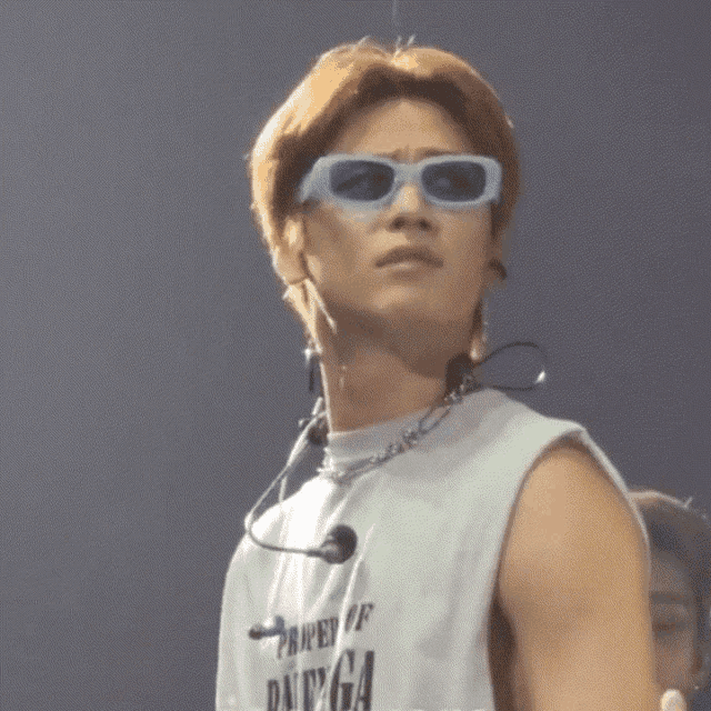 a man wearing sunglasses and a shirt that says joomovers