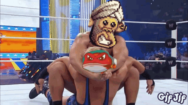 a gif of two wrestlers in a wrestling ring with the words gifjf written on the bottom