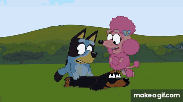 a blue dog and a pink poodle standing next to each other
