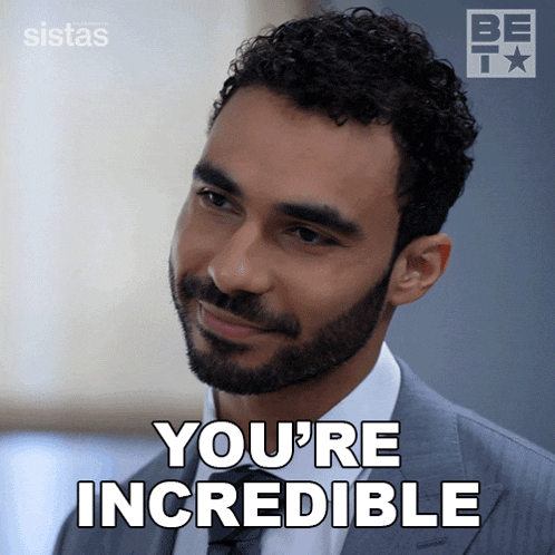 a man in a suit and tie with the words you 're incredible below him