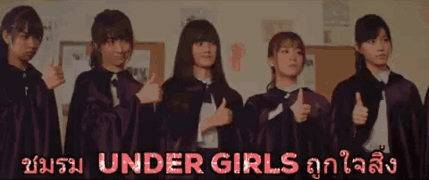 a group of girls giving a thumbs up with the words under girls in the corner