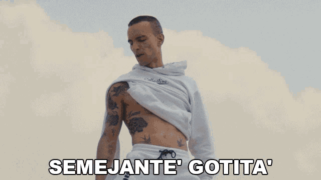 a man with a tattoo on his chest is standing in front of a cloudy sky with the words semejante gotta below him