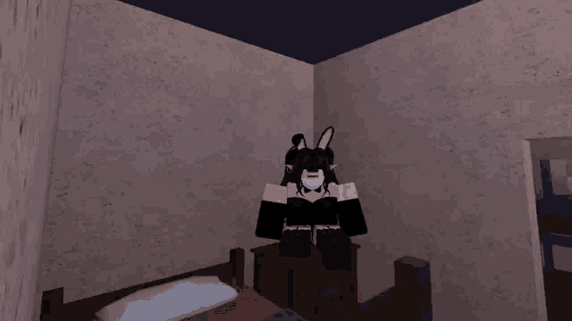 a cartoon character with bunny ears is sitting on a bed