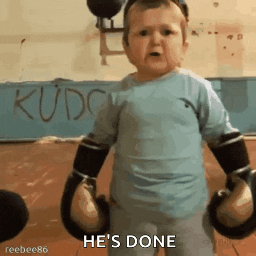 a baby wearing boxing gloves says he 's done in a gym
