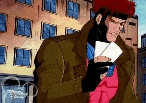 gambit from the x-men is holding a pair of playing cards