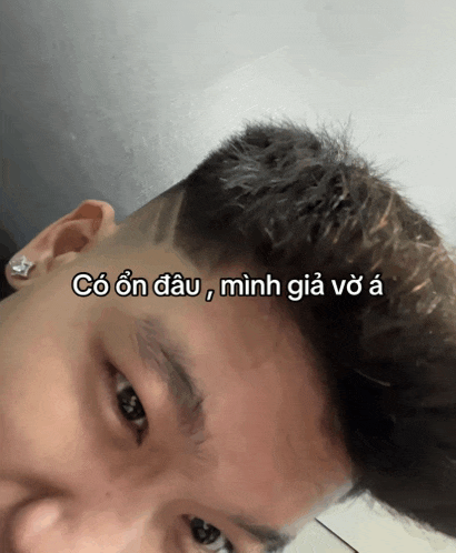 a close up of a man 's face with a foreign language caption on it