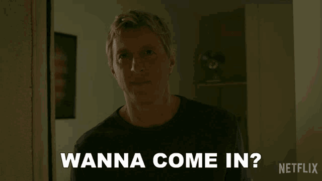 a man says " wanna come in " in a dark room