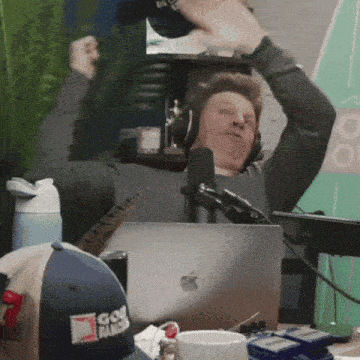 a man wearing headphones and a hat that says go ranger