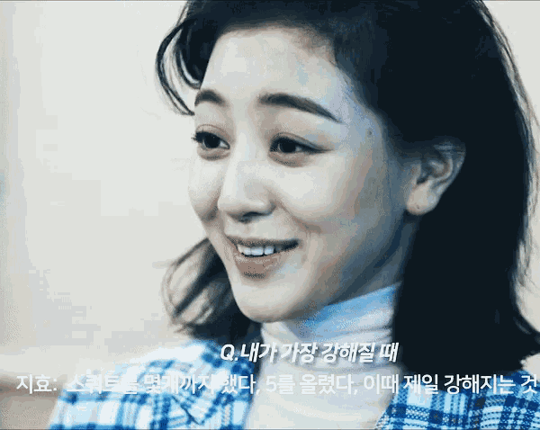 a close up of a woman 's face with korean writing on the bottom right